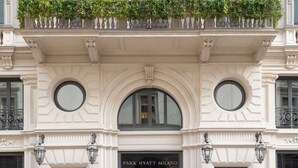 A classical building facade with a central entrance, large windows, and decorative moldings. - Park Hyatt Milano (Milan)