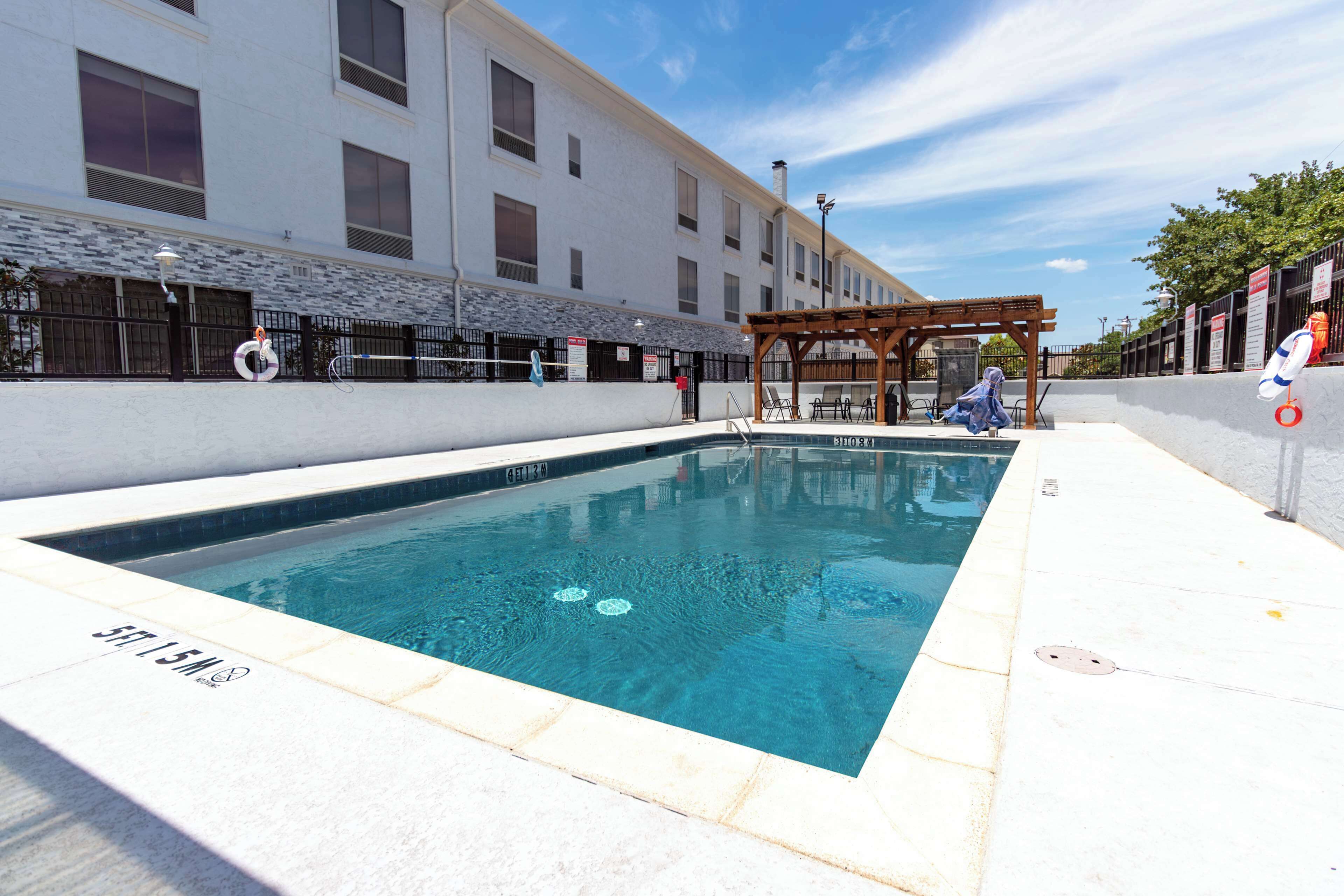 Seasonal outdoor pool, pool loungers