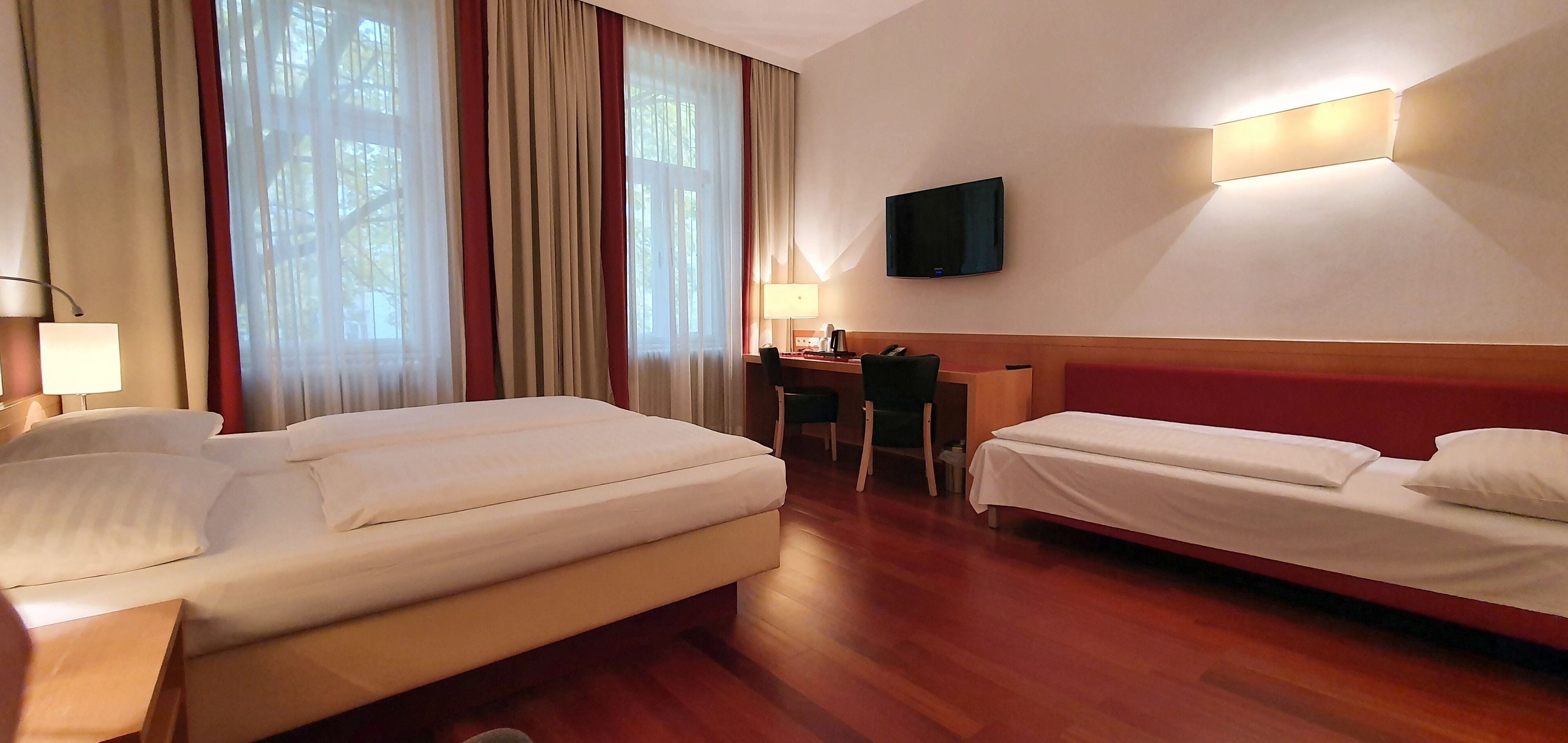 deluxe quadruple room | living area | 37-inch lcd tv with satellite channels, tv