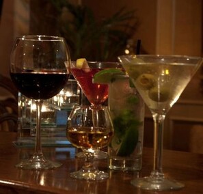 Three different types of glasses on a table, likely in a bar setting. - The Sanford House Inn & Spa (Arlington)