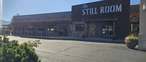 A building with a sign reading "The Still Room" and "Restaurant Bar Casino".