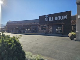 A building with a sign reading "The Still Room" and "Restaurant Bar Casino".