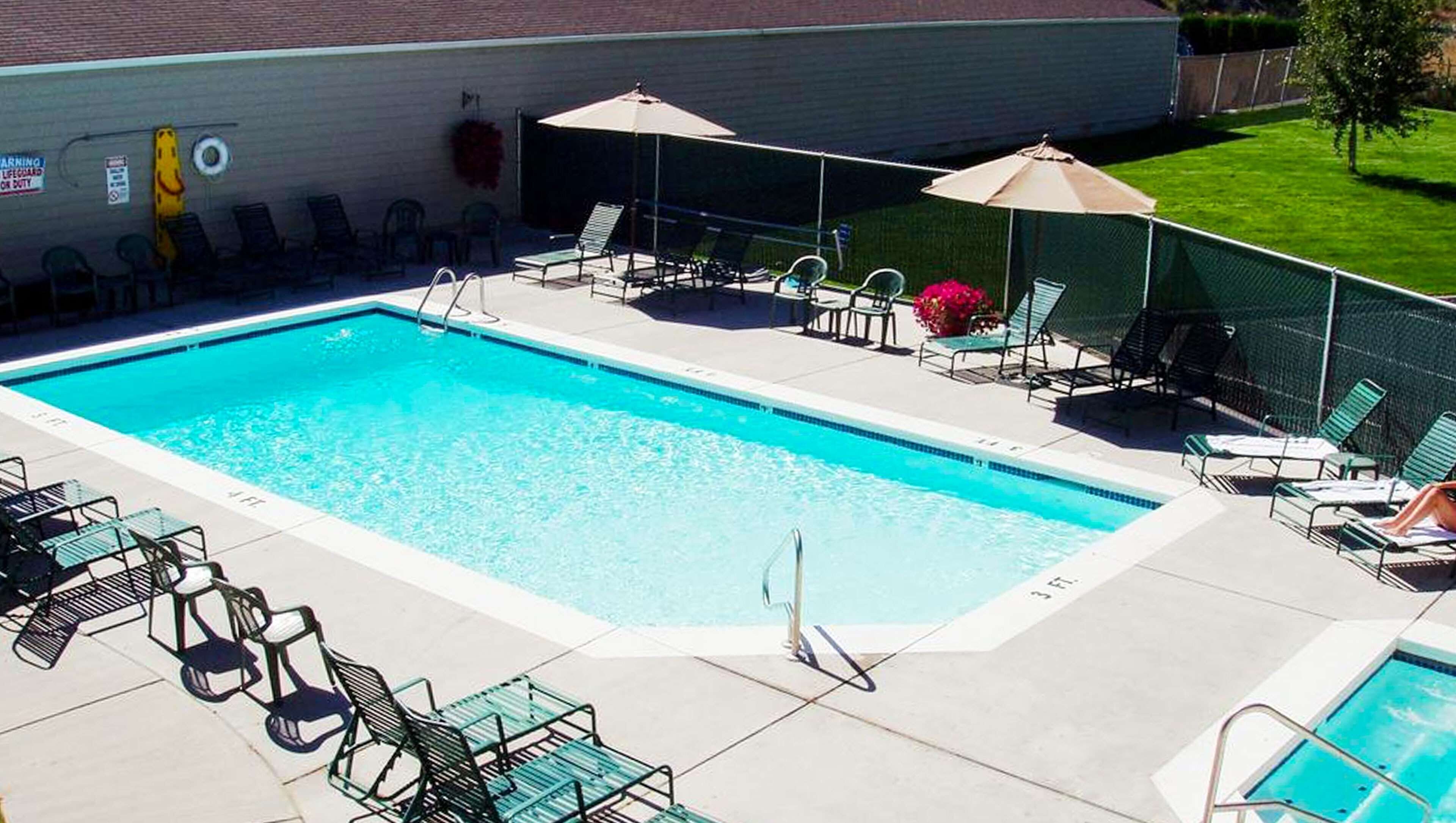 seasonal outdoor pool, open 9 am to 10 pm, pool umbrellas, pool loungers
