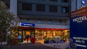 A hotel exterior with a restaurant named 'Best Western' and a reception area. - Best Western Montecristo (Bastia)