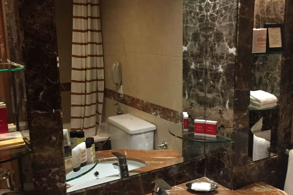 premium suite city view queen bed | bathroom amenities | rainfall showerhead, free toiletries, hair dryer, bathrobes