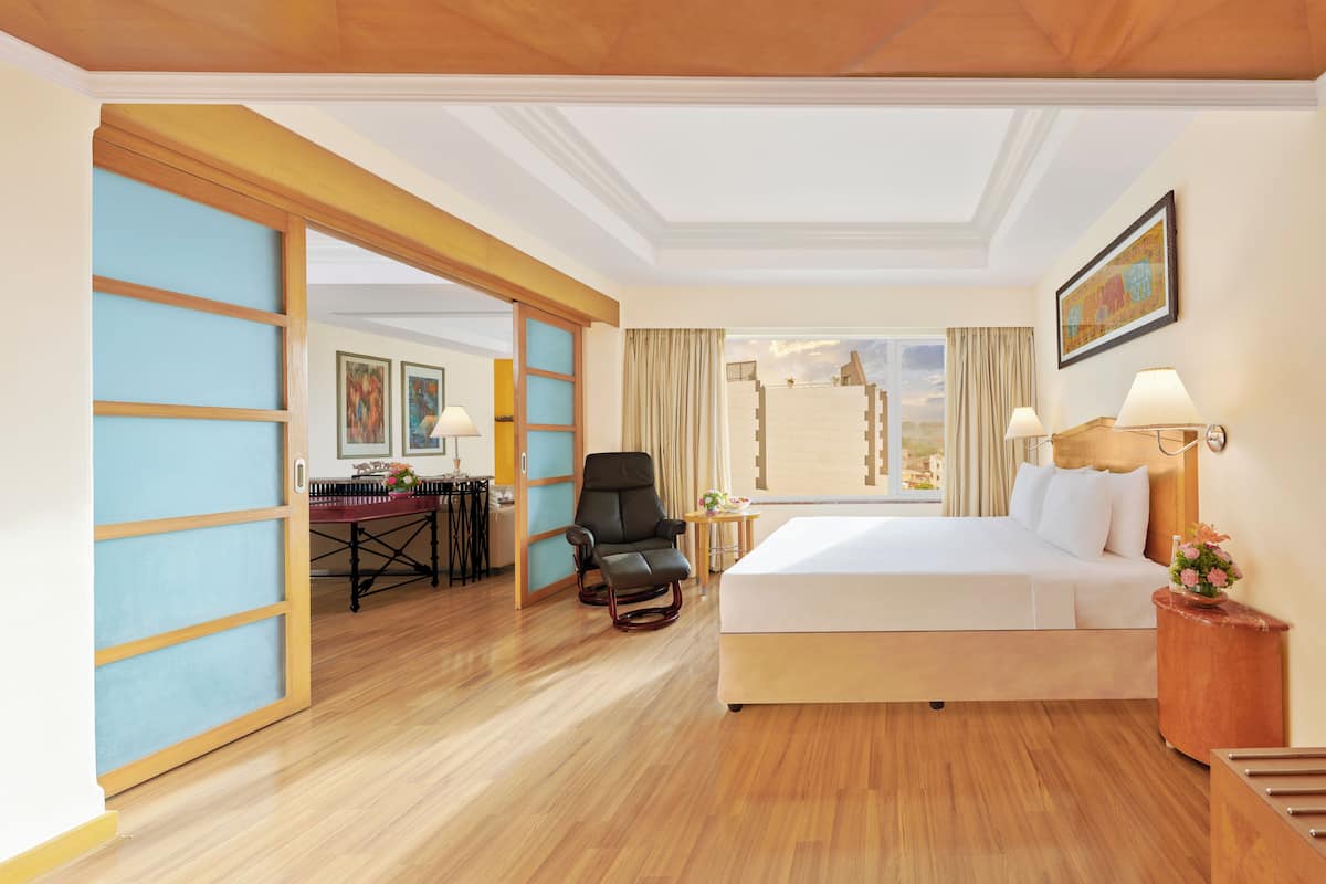 deluxe suite city view queen bed | minibar, in-room safe, desk, laptop workspace