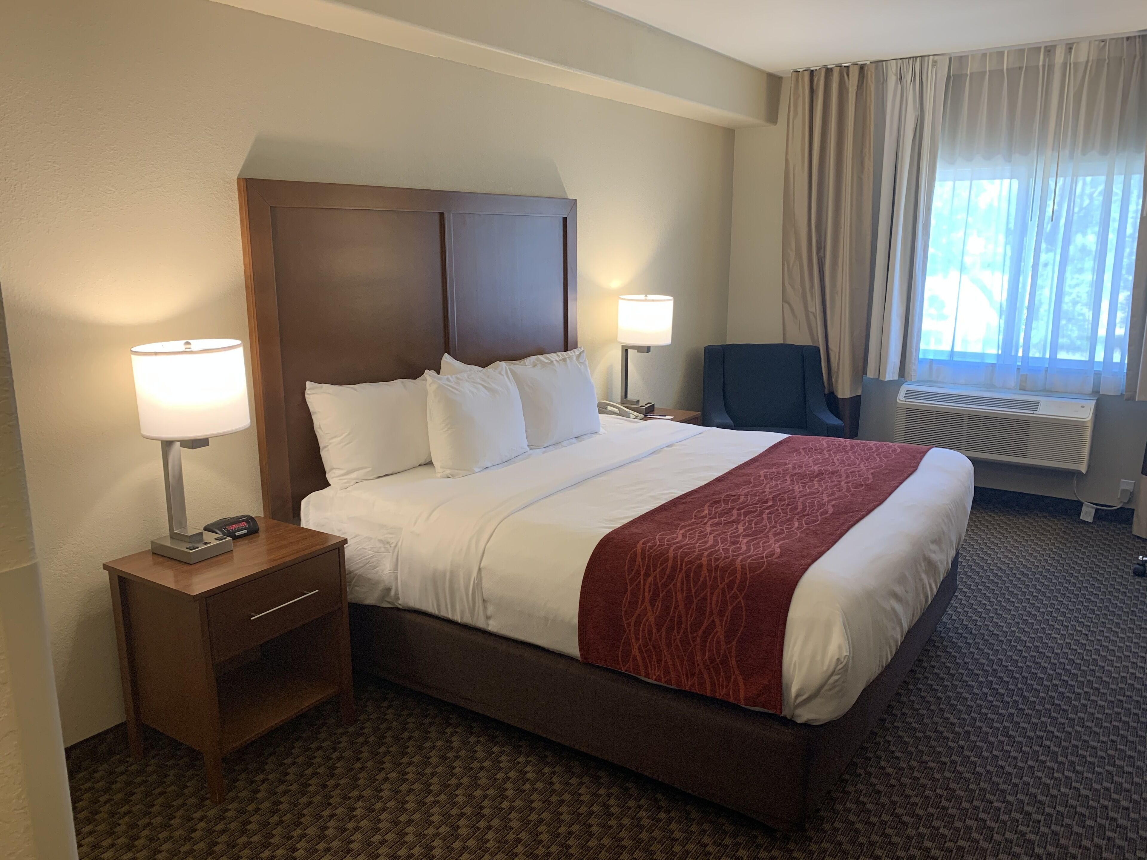 Desk, laptop workspace, blackout drapes, iron/ironing board