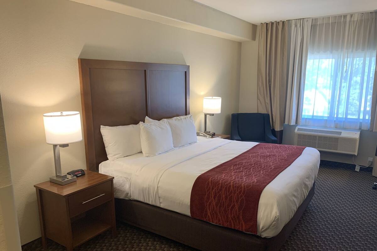 Desk, laptop workspace, blackout curtains, iron/ironing board