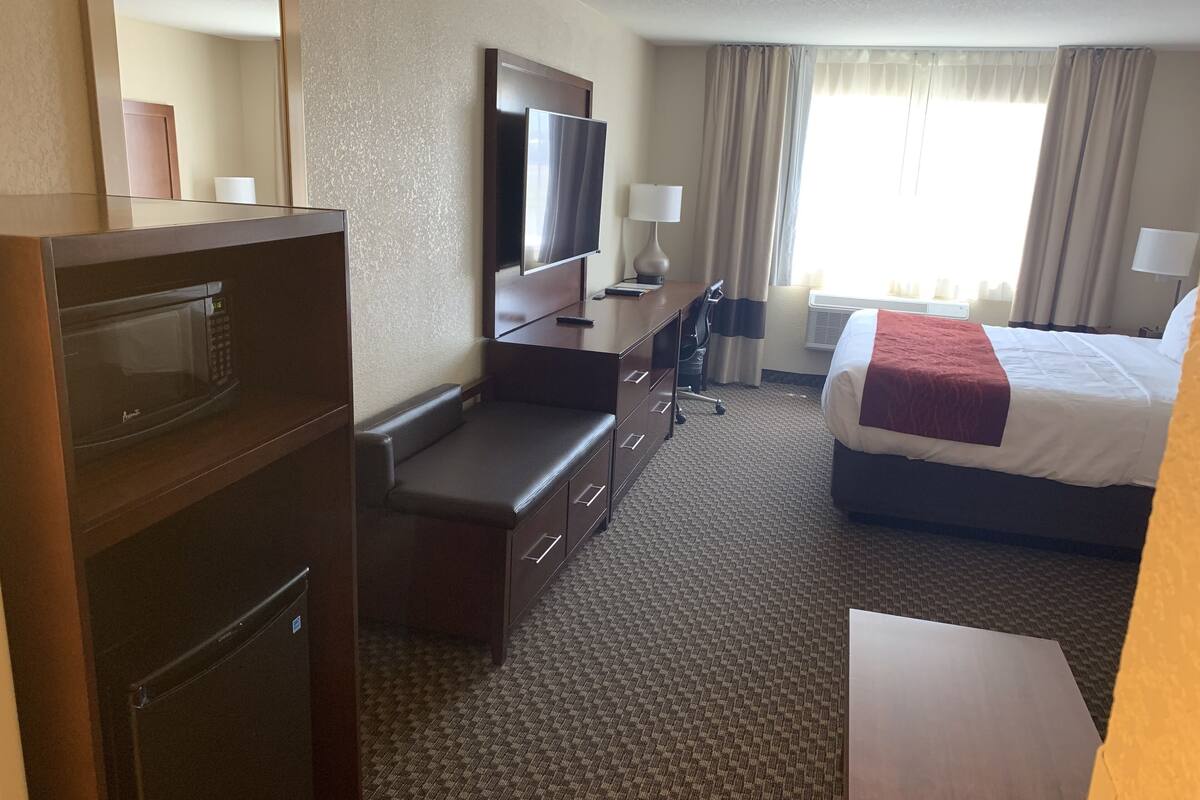 desk, laptop workspace, blackout curtains, iron/ironing board