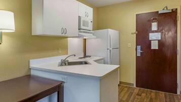 Full-size fridge, microwave, stovetop, coffee/tea maker