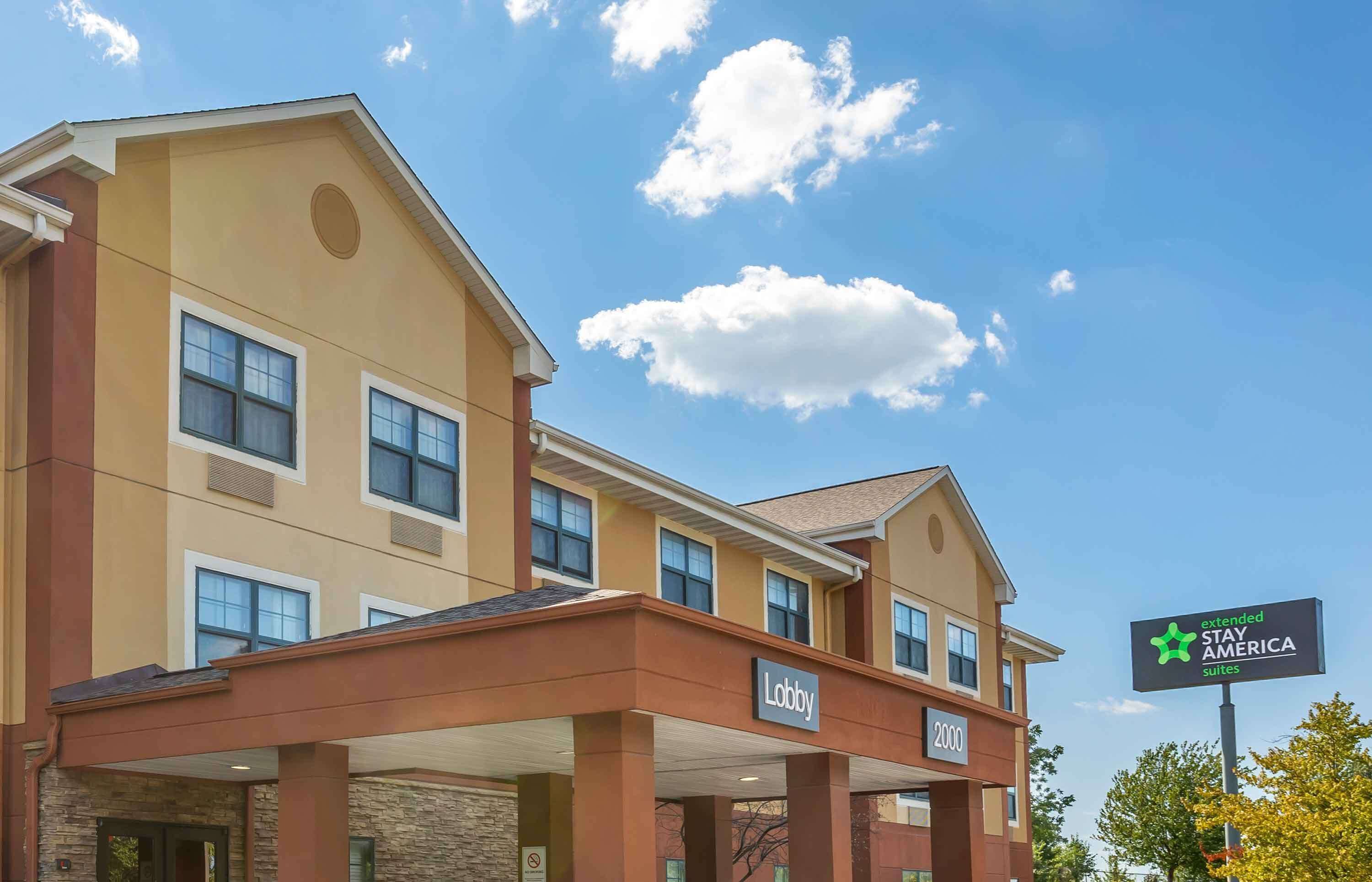 A hotel with a 'Lobby' sign, a '2000' number, and a 'Stay America Suites' sign.