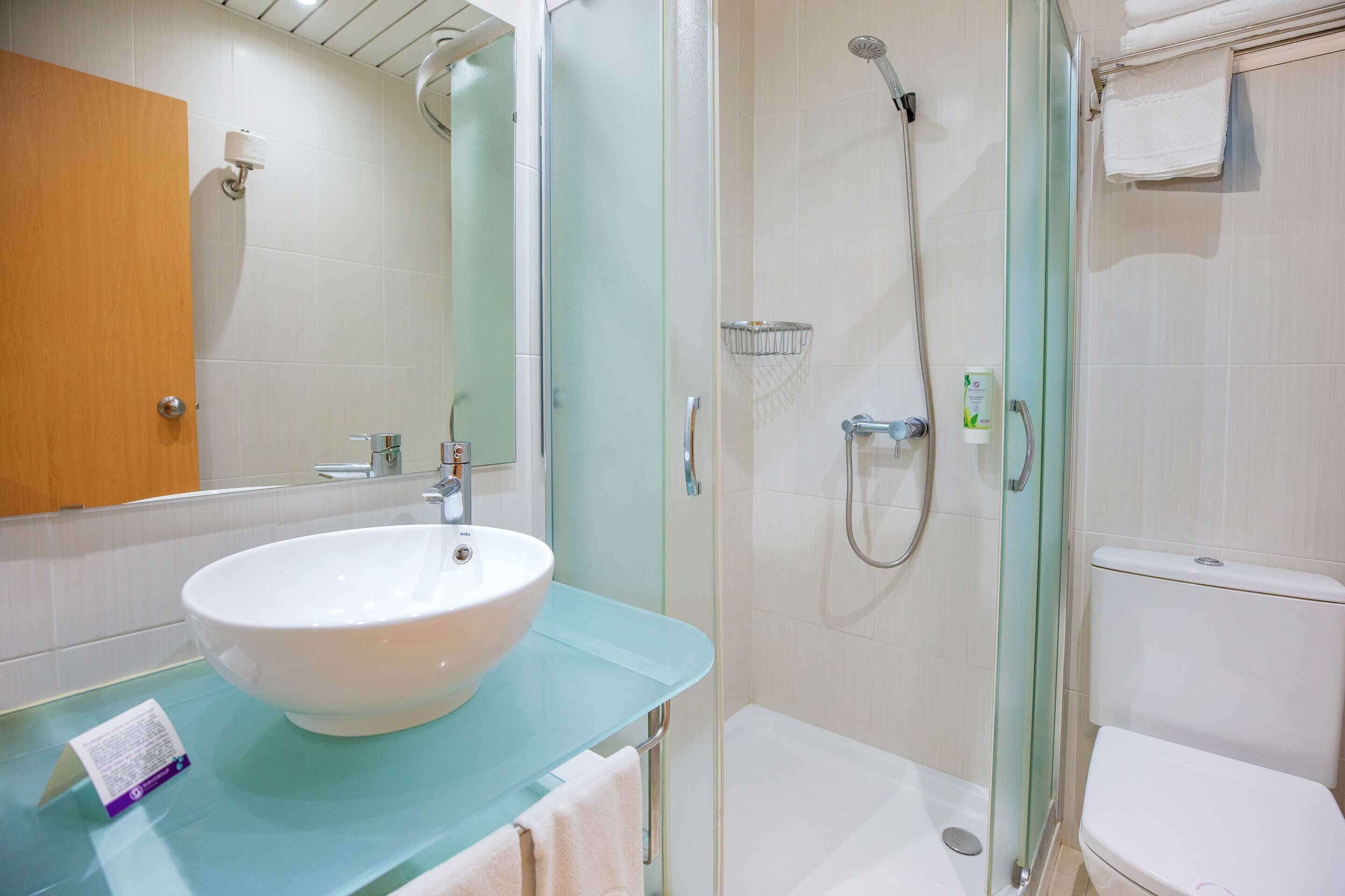 single room, balcony, city view | bathroom | shower, hair dryer, towels