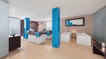 Relax in a spacious room with a large bed, two bedside tables, and a comfortable seating area.