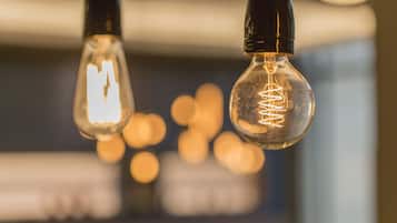 Two hanging light bulbs with visible filaments.