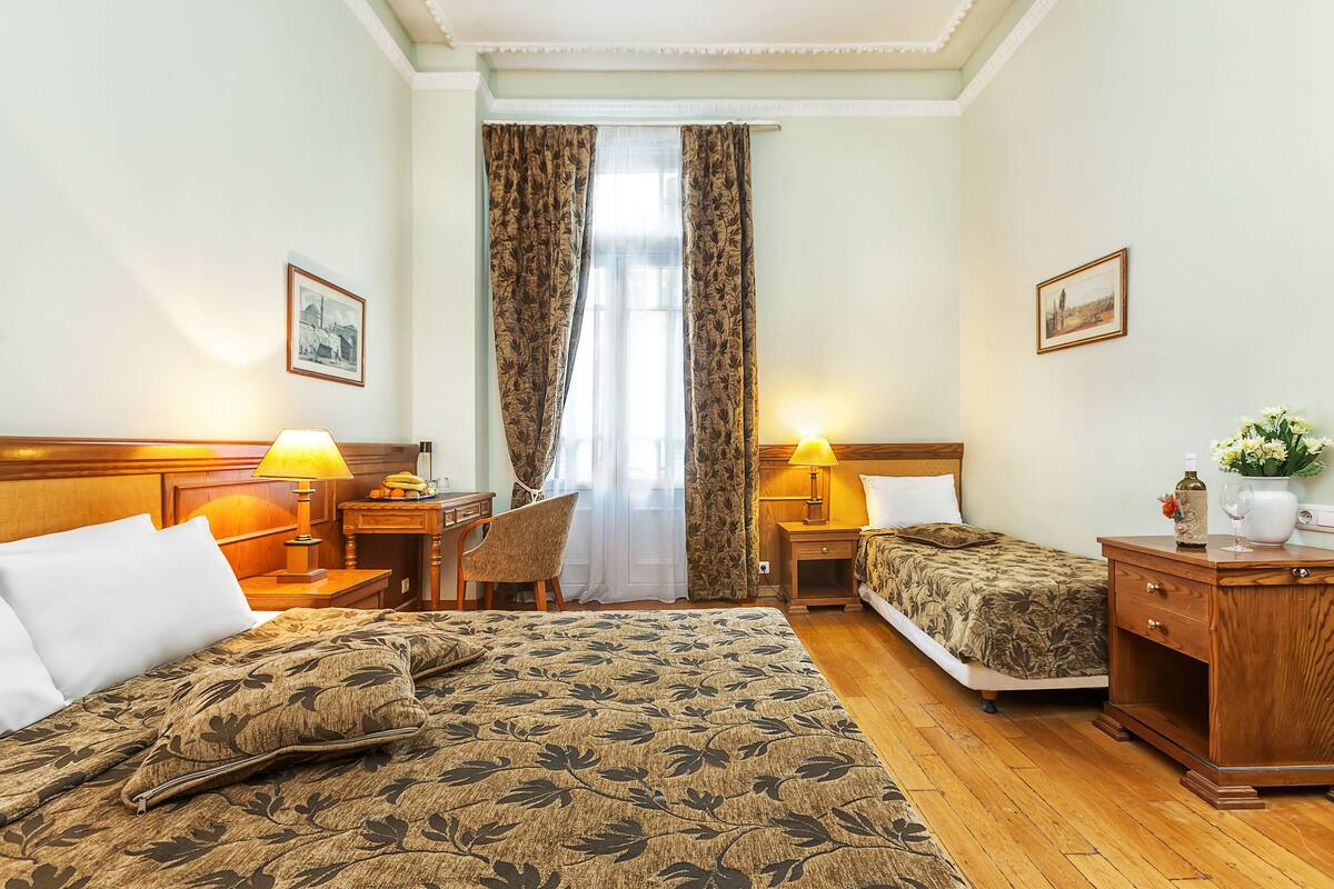 Standard Triple Room | Minibar, in-room safe, soundproofing