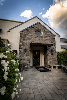 Hotel exterior and entrance at The Chateau at Lake La Quinta