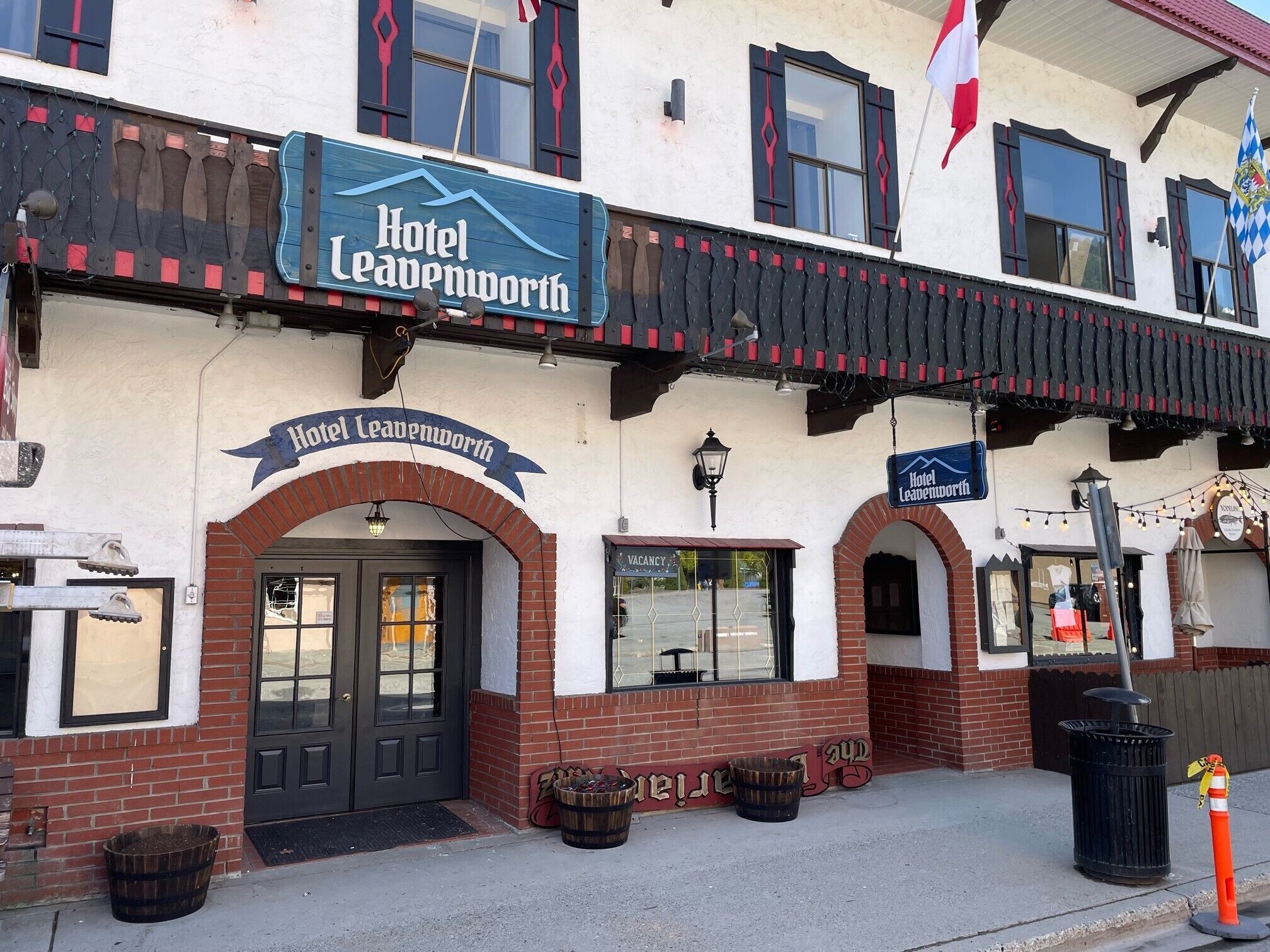 Hotel Leavenworth with a prominent sign, brick facade, and a visible entrance.