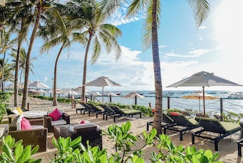 On the beach, sun loungers, beach umbrellas, beach towels at The Reef Coco Beach Resort & Spa- Optional All Inclusive