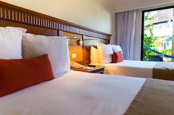 In-room safe, blackout drapes, iron/ironing board, bed sheets at The Reef Coco Beach Resort & Spa- Optional All Inclusive