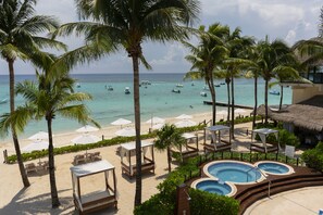 On the beach, sun-loungers, beach umbrellas, beach towels