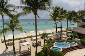 On the beach, sun-loungers, beach umbrellas, beach towels