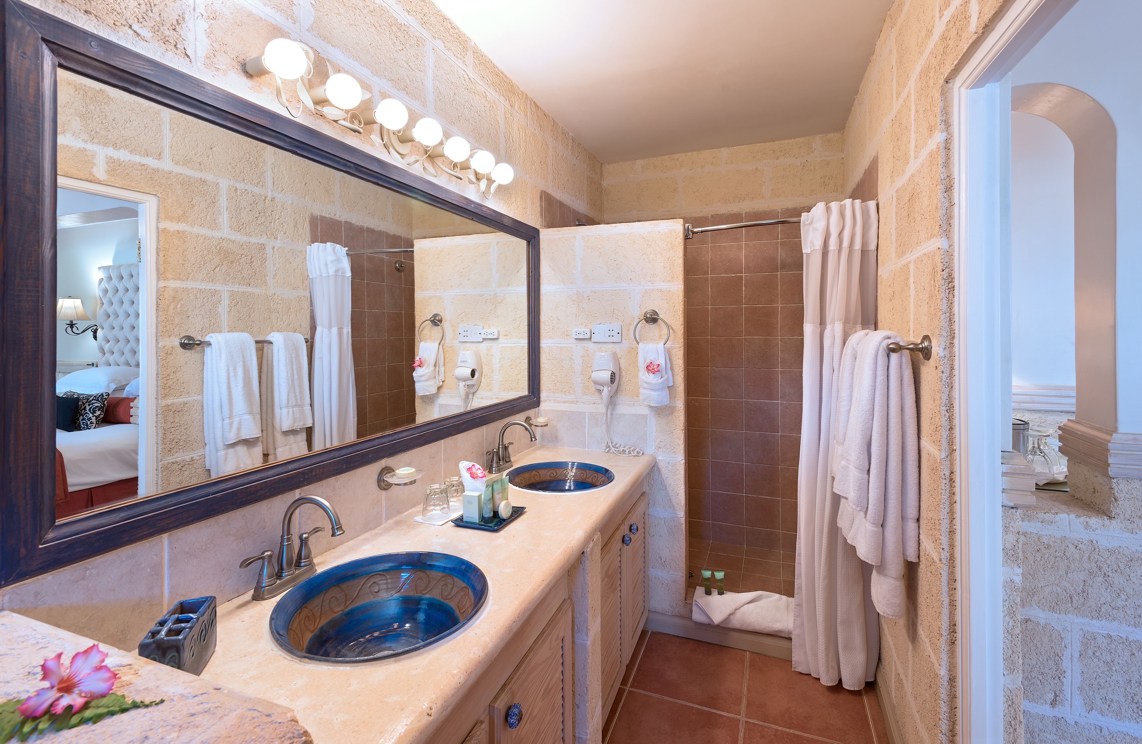 junior suite, jetted tub, garden area | bathroom | shower, designer toiletries, hair dryer, bathrobes
