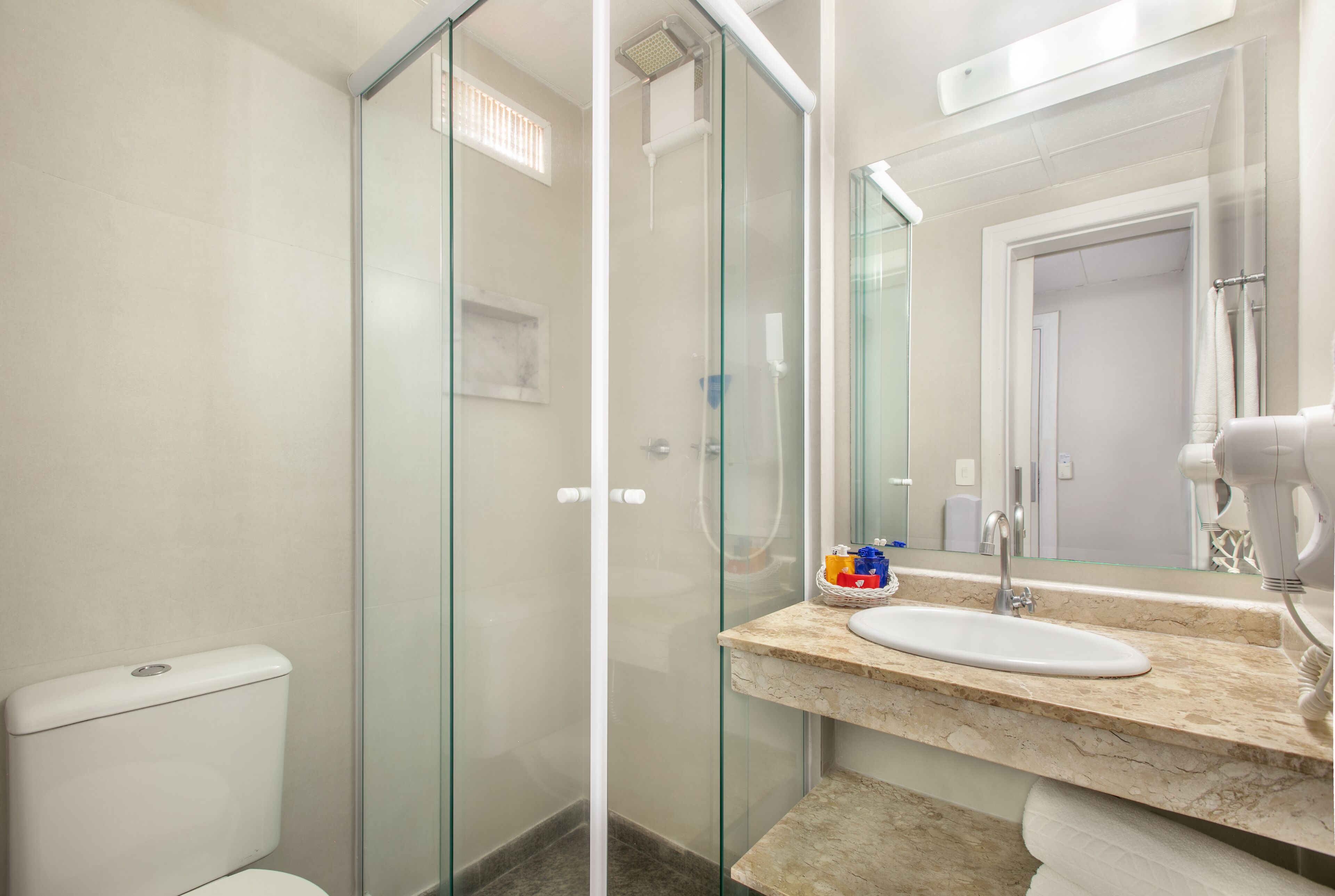 deluxe triple room | bathroom | shower, free toiletries, hair dryer, towels