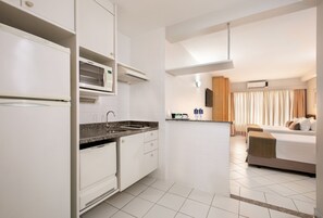 Fridge, microwave, stovetop, cookware/dishes/utensils