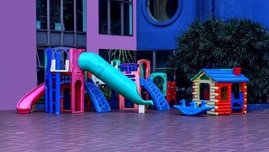 A playground with various play structures including slides and climbing frames. - Falls Galli Hotel (Foz do Iguaçu)