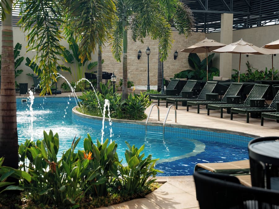 Outdoor pool, open 10:00 AM to 10:00 PM, pool umbrellas, sun loungers