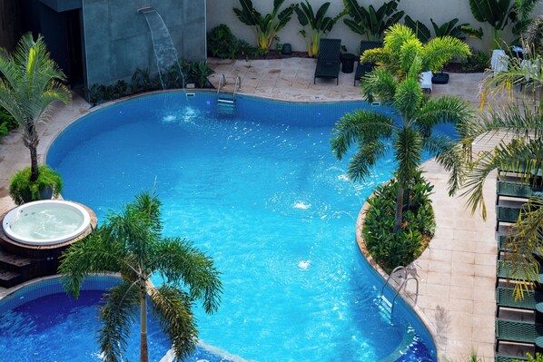Outdoor pool, open 10:00 AM to 10:00 PM, pool umbrellas, pool loungers