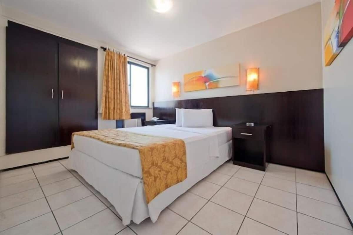 Apartamento Twin | Minibar, brankas, tirai kedap cahaya, dan Wi-Fi gratis