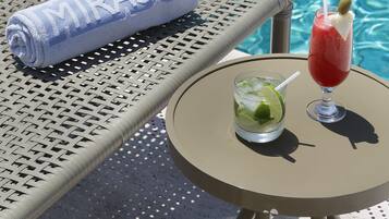 Outdoor pool, open 9:00 AM to 10:00 PM, pool loungers