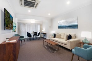 Suite, 2 Bedrooms | Living area | 50-inch LED TV with digital channels, TV, streaming services