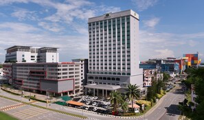 A modern hotel with a prominent tower, a medical center, and a parking area. - Sunway Hotel Seberang Jaya (Seberang Jaya)