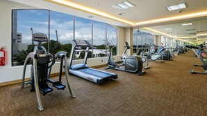 A gym with treadmills, ellipticals, and a mirrored wall. - Sunway Hotel Seberang Jaya (Seberang Jaya)