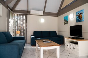 Eco Villa | Living area | 32-inch LCD TV with cable channels, TV, DVD player