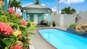 Outdoor pool, open 9 AM to 9 PM, pool loungers