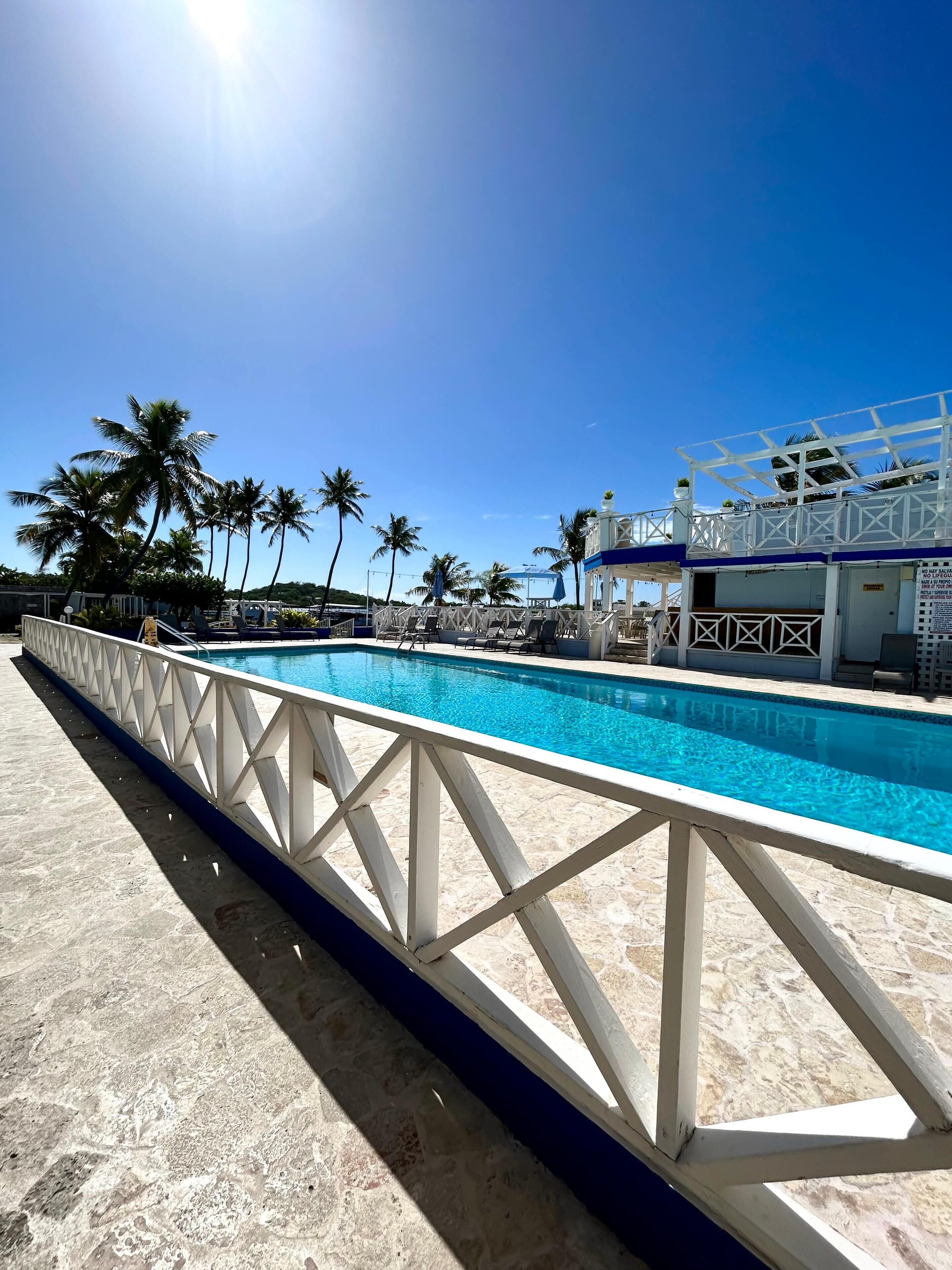 outdoor pool, open 7:00 am to 9:00 pm, pool umbrellas, pool loungers