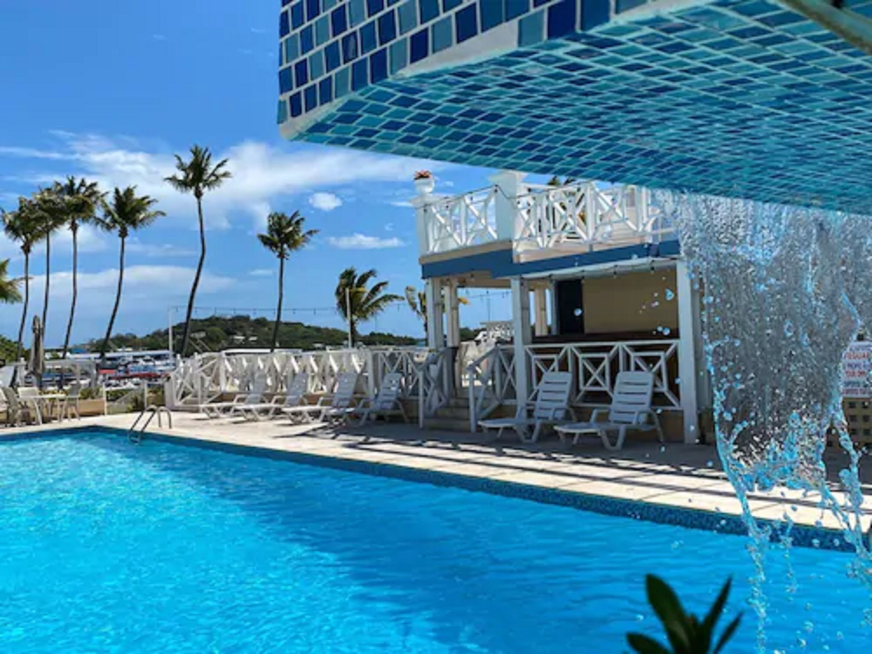 Outdoor pool, open 7:00 AM to 9:00 PM, pool umbrellas, pool loungers