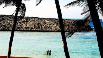 On the beach, sun-loungers, beach umbrellas, beach towels