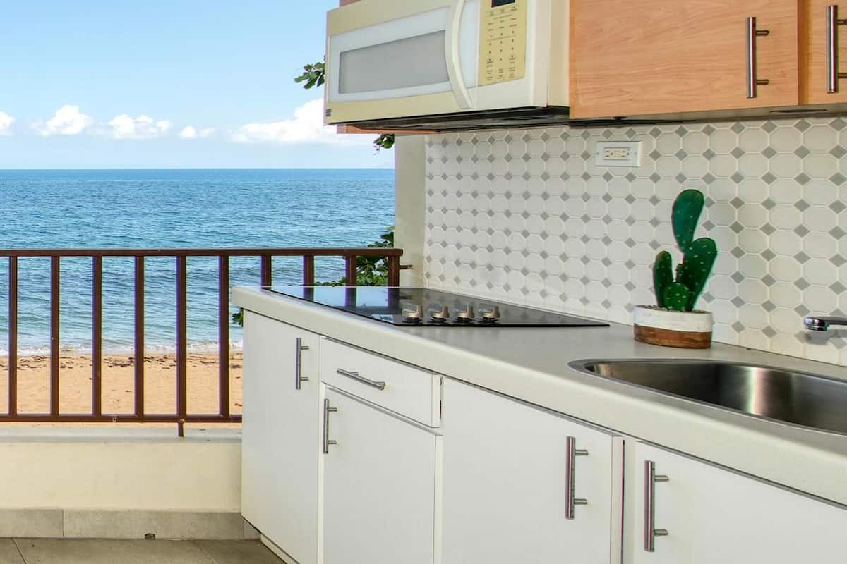 apartment, ocean view, beachfront | private kitchen | fridge, coffee/tea maker