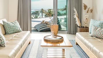 One Bedrooom Apartment - Beach Views | Living area | 32-inch Smart TV with digital channels, TV, Netflix