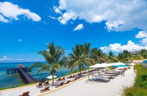 On the beach, white sand, free beach cabanas, sun-loungers