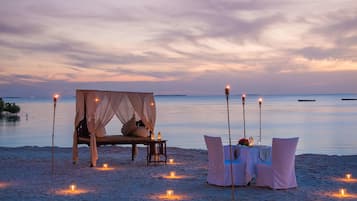 On the beach, white sand, free beach cabanas, sun loungers