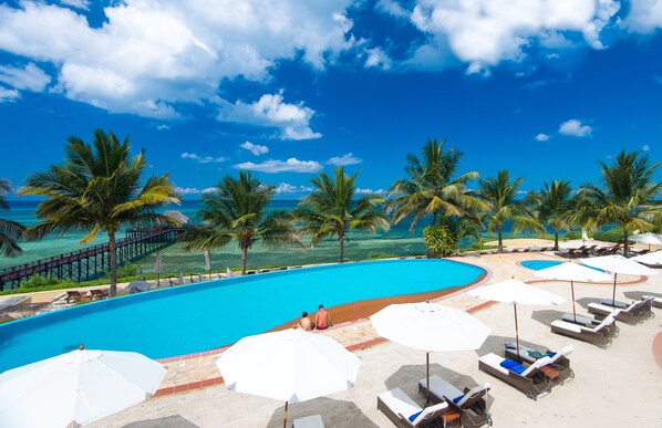 2 outdoor pools, pool umbrellas, pool loungers