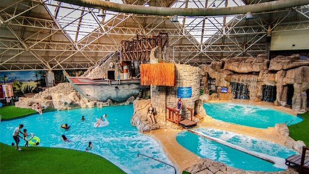 An indoor water park with multiple pools, slides, and a shipwreck-themed play area. - Emerald Resort & Casino (Vanderbijlpark)
