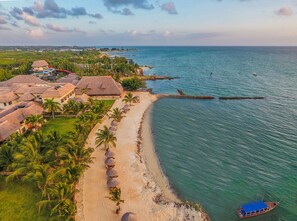 Private beach, white sand, sun loungers, beach umbrellas