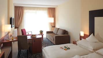 Roupas de cama premium, edredons de pluma, frigobar, cofres nos quartos