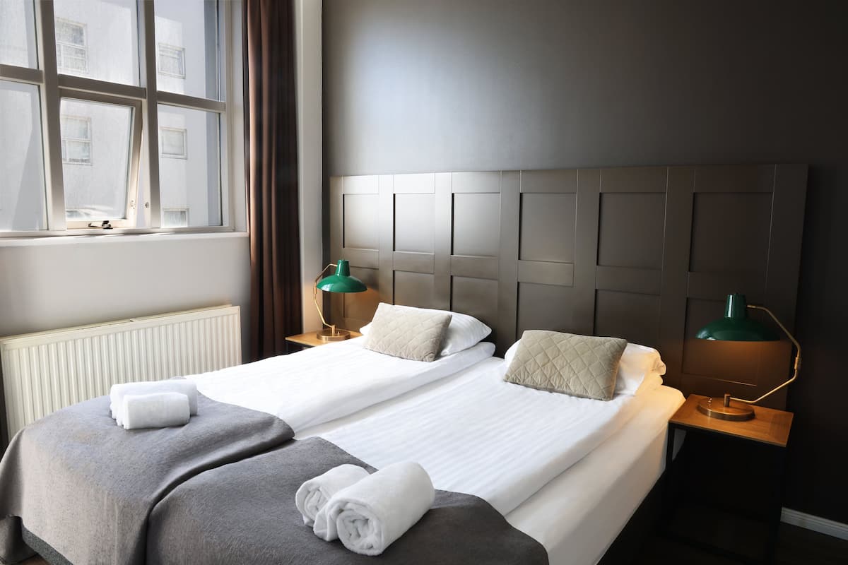 family room | in-room safe, desk, blackout curtains, iron/ironing board